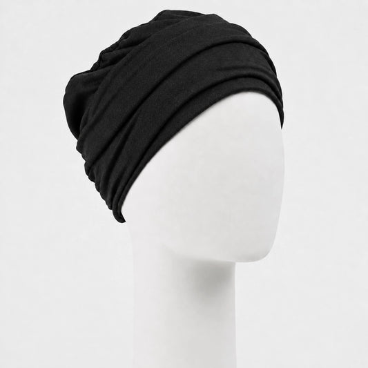 Bonnet twist Sibelle en tricot noit vue côté droit sur fond blanc